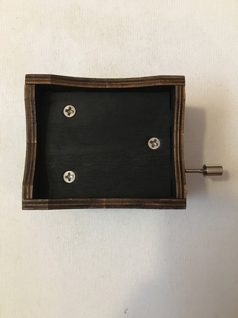 Hand crank music box with wood engraving