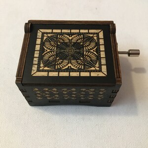 Hand crank music box with wood engraving