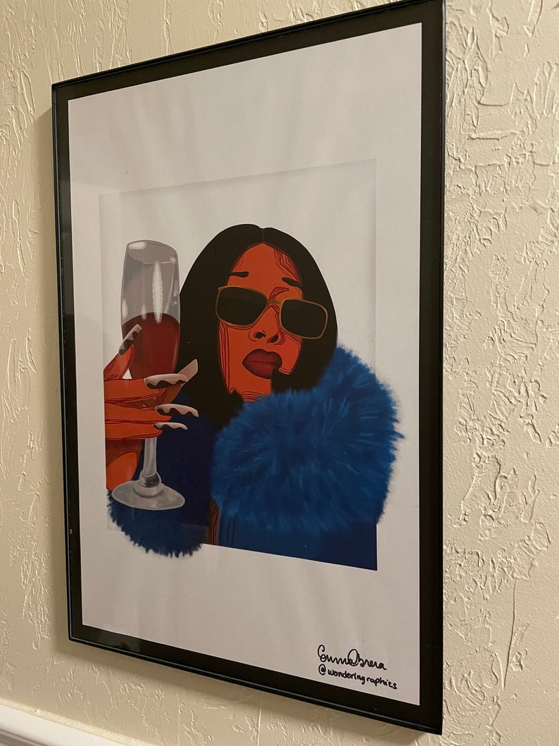 May include: A digital illustration of a woman with red hair and sunglasses wearing a blue fur coat and holding a glass of red wine. The image is signed "Sunnie Drew" and "@wondering.graphics".