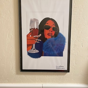 May include: A digital illustration of a woman with red hair and blue fur wearing sunglasses and holding a glass of red wine. The image is signed "Bernice Drew @wondering.my.pix".