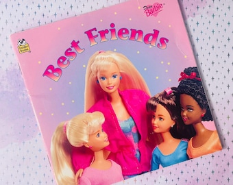 May include: A vintage "Dear Barbie Best Friends" book cover featuring four Barbie dolls. The cover is pink with the words "Best Friends" in a bubble font. The dolls are blonde, brunette, and black-haired, wearing pink, blue, and orange outfits.