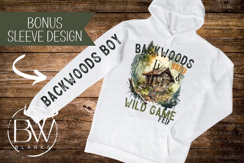 May include: White hooded sweatshirt with a watercolor design of a cabin in the woods. The text "Backwoods Bred & Wild Game Fed" is printed on the front of the sweatshirt. The text "Backwoods Boy" is printed on the sleeve.