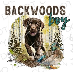 May include: A graphic design featuring a brown Labrador puppy running through a forest scene with a duck. The text "BACKWOODS boy" is displayed above the puppy in brown and teal lettering. The design has a white background.