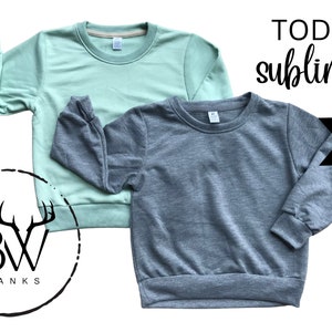 May include: Two toddler-sized sweatshirts, one in a light green color and one in a gray color. Both sweatshirts are 100% polyester and are suitable for sublimation printing. The text "TODDLER sublimation BLANKS 100% POLYESTER" is visible in the image.