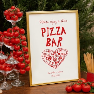 May include: A wooden table displays a pizza bar setup. A framed sign reads "Pizza Bar" with a heart-shaped pizza illustration. Cherry tomatoes fill champagne glasses and are arranged on the table. A pizza slice sits on a wooden board.
