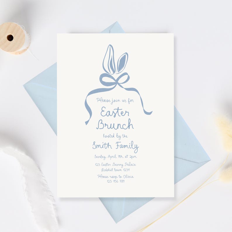 May include: A blue and white Easter brunch invitation with bunny ears and a bow. The invitation reads "Please join us for Easter Brunch hosted by the Smith Family. Sunday April 7th at 2pm. 123 Easter Bunny Palace Rabbit town 1231. Please RSVP to Olivia 123 456 789"