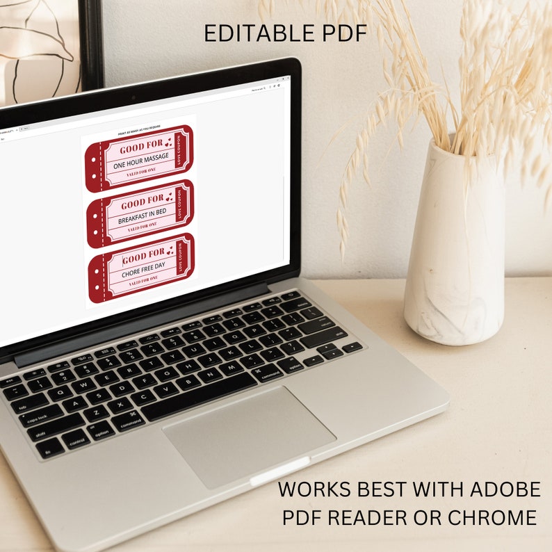 May include: A laptop computer displaying a digital document with three red and white printable coupons. The coupons are for "One Hour Massage", "Breakfast in Bed", and "Chore Free Day". The text "Editable PDF" is displayed above the coupons. The text "Works Best With Adobe PDF Reader or Chrome" is displayed below the laptop.