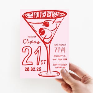 May include: A pink invitation with red text and a red illustration of a martini glass with olives. The text reads "CHEERS", "JOIN US FOR Olivia's 21st", "28.02.25", "PARTY STARTS AT 7PM", "123 Happy st. Your Place 1234", and "RSVP TO OLIVIA 123 456 789".