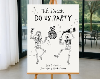 May include: A white sign on a wooden easel with the text "Til Death Do Us Party" and skeleton illustrations. One skeleton holds a glass, the other pours wine. The sign also says "Let's Celebrate Samantha's Bachelorette".