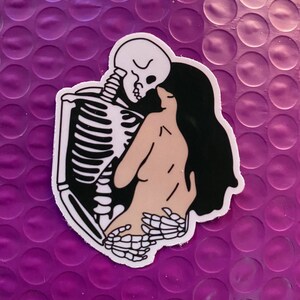 Skeleton Hugging Girl Sticker