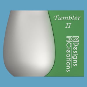 May include: A white tumbler with a green label that says "Tumbler II" and "N Designs M Creations".