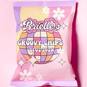 May include: A pink and purple bag of chips with a retro design. The bag features a disco ball, the text "Brielle's Groovy Chips", and the date "01.02.202X".