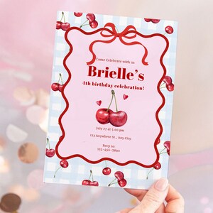 May include: A pink and blue birthday invitation with a cherry theme. The invitation says "Come Celebrate with us Brielle's 4th birthday celebration!"  July 27 at 5:00 pm 123 Anywhere St., Any City. Revp to 123-456-7890