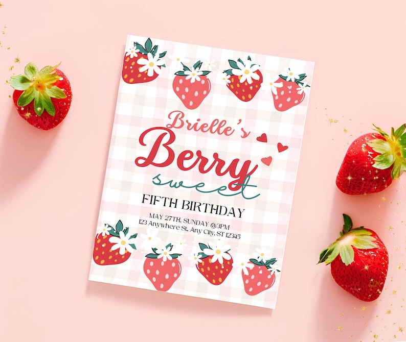 May include: A pink and white gingham-patterned invitation with strawberry illustrations. The text reads "Brielle's Berry Sweet Fifth Birthday." Fresh strawberries with green stems are scattered around the invitation on a pink background.