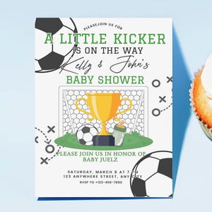 May include: A baby shower invitation with a soccer theme. The invitation features a soccer ball, a golden trophy, and the text "A Little Kicker Is On The Way." The invitation also includes the names "Kelly & John's" and event details.