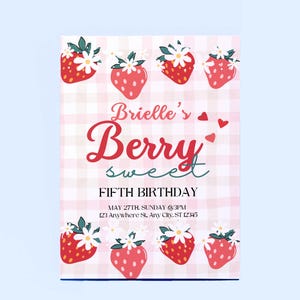 May include: A light blue invitation card with a pink gingham pattern background. The card features red strawberries with white flowers and the text "Brielle's Berry Sweet Fifth Birthday". The date and address are also included.