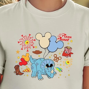 a woman wearing a mickey mouse ears shirt