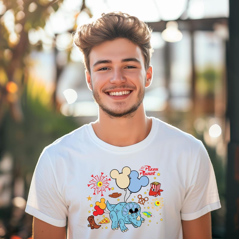 a man with a mickey mouse t - shirt on