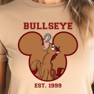 Bullseye in Mouse Ears T-shirt, Toy Story-Inspired T-shirt, Perfect Disney Fan Gift, Ideal for Family Vacation, Unisex Disney Style Shirt