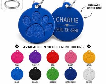 May include: Two round blue metal pet ID tags with a textured paw print design on the front and custom engraving on the back. The text reads CHARLIE and a phone number. Ten color options are shown including pink, purple, red, rose, gold, blue, black, green, dark blue, and silver.