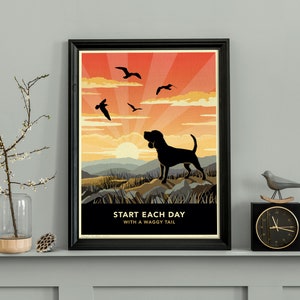 May include: A black silhouette of a dog with a wagging tail against a sunset background. The text "Start Each Day With A Waggy Tail" is at the bottom of the image.