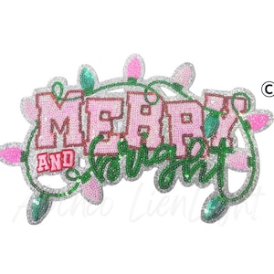 May include: A sequined Christmas decoration with the words "MERRY AND BRIGHT" in pink and green. The design includes string lights with pink and green bulbs, all outlined in silver sequins. The overall shape is irregular.