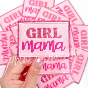 May include: Pink and white iron-on patch with glitter lettering that reads "Girl mama".