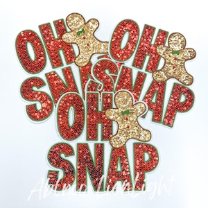 May include: Three red and green sequined patches with the words "Oh Snap" and a gingerbread man design.
