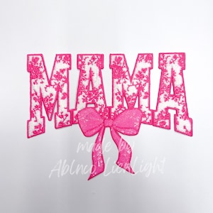 May include: Pink felt applique of the word "MAMA" with a pink sequin bow.