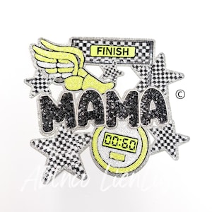 May include: A black and white sequined patch with the word "MAMA" in large letters. The patch also features a yellow winged foot, a checkered finish line, a yellow stopwatch with the time 00:50, and four black and white stars.
