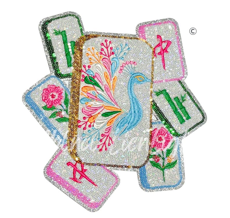 May include: A collection of sequined, rectangular accessories with embroidered designs. The central piece features a blue peacock with a colorful tail. Other pieces display floral and bamboo motifs, and Chinese characters. A gold chain is attached.
