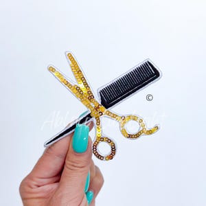 May include: Gold sequin scissors and a black comb, a patch for sewing or iron-on projects.