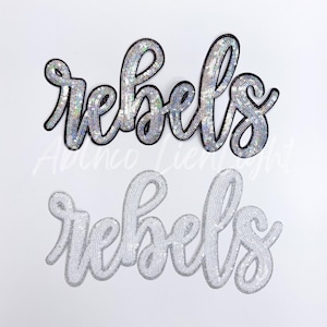 May include: Two sequined "rebels" patches in a cursive font. The top patch has silver sequins with a black outline. The bottom patch is a lighter silver color. Both patches are on a white background.