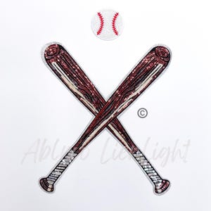 May include: Two crossed baseball bats made of sequins in red, brown, and white. A white baseball with red stitching is above the bats.
