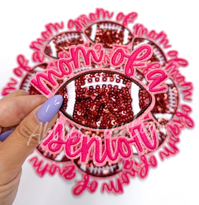 May include: Pink and brown iron-on patch with the text "Mom of a Senior" and a sequined football design.