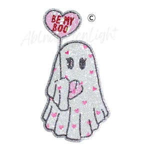 May include: A sequined ghost patch holding a pink heart-shaped balloon. The balloon has the text "BE MY BOO" in red. The ghost is white with pink heart accents and black outlines. A fun, romantic, and spooky design.