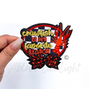 May include: A red, white, and black embroidered patch with a crawfish and the text "Crawfish is my favorite season".