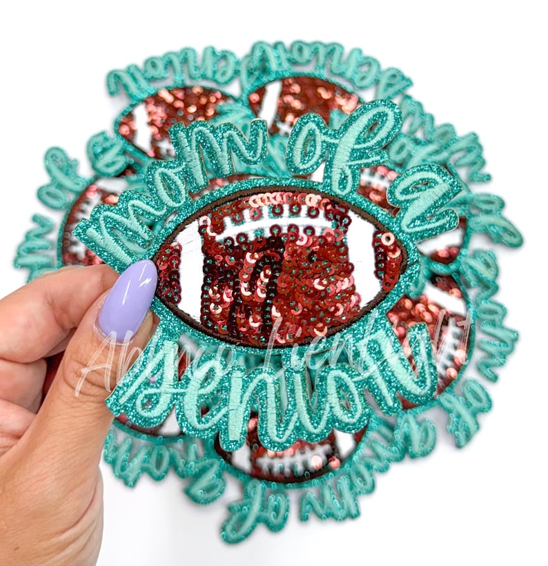 May include: A set of teal and brown iron-on patches with the text "Mom of a Senior" and a sequined football design.