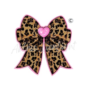 May include: A large bow with a leopard print pattern in shades of brown and black, outlined in pink. A pink heart is centered on the bow. The bow is a decorative element, possibly for crafts or accessories.