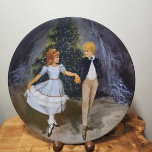 May include: A set of three ceramic mugs with a speckled, matte finish. The mugs are in shades of cream, light gray, and dark gray. Each mug has a simple, minimalist design and a rounded handle.