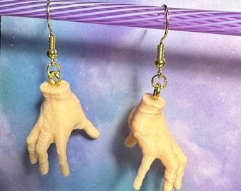 Hand earrings. These are fun and a little creepy. Perfect for Halloween or every day. Fans of Wednesday or the Adam’s Family will love them!