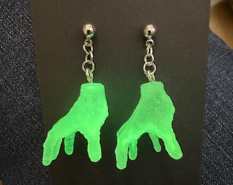 Glow in the dark “Thing” earrings. These are fun and a little creepy. Perfect for Halloween or every day. Fans of Wednesday will love them!