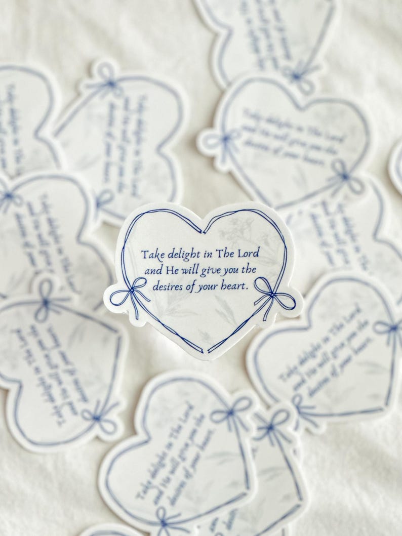 May include: A set of heart-shaped stickers with a blue and white marble pattern. The stickers feature the text "Take delight in The Lord and He will give you the desires of your heart."