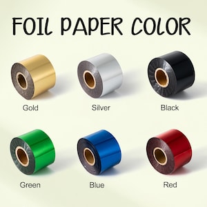 May include: Six rolls of foil paper in gold, silver, black, green, blue, and red. Each roll is labelled with its colour name. The text "FOIL PAPER COLOR" is displayed above the rolls.