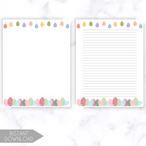 K&ouml;nnte beinhalten: Zwei wei&szlig;e Papierb&ouml;gen mit Osterei-Designs. Einer ist leer, der andere hat Linien. Pastellfarbene Ostereier schm&uuml;cken die oberen und unteren R&auml;nder. Der Text "INSTANT DOWNLOAD" befindet sich unten.