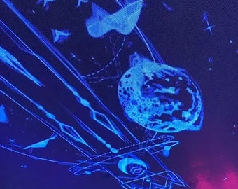 May include: A blue and purple ceiling with a projected image of a spaceship, stars, and a planet. The image is created with a projector.