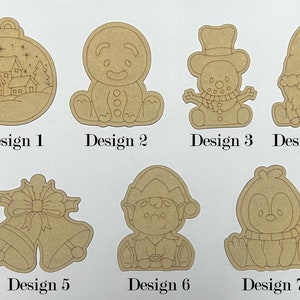 May include: Seven unfinished wooden Christmas decorations, each with a different design. The designs include a snowman, a penguin, a gingerbread man, a Christmas tree, a bell, an elf, and a gnome. The decorations are all blank and ready to be painted.