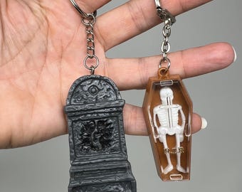 Vintage Keyring Pair: 1990s Goosebumps Tombstone and 1980s Skeleton In Coffin