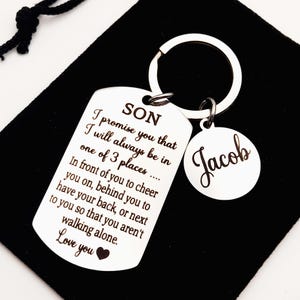 May include: Silver keychain with a dog tag that reads "SON I promise you that I will always be in one of 3 places... In front of you to cheer you on, behind you to have your back, or next to you so that you aren't walking alone. Love you" and a round tag that reads "Jacob".