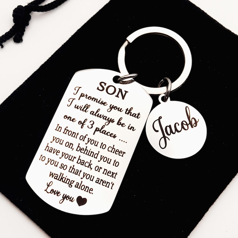 May include: Silver keychain with a dog tag that reads "SON I promise you that I will always be in one of 3 places... In front of you to cheer you on, behind you to have your back, or next to you so that you aren't walking alone. Love you" and a round tag that reads "Jacob".